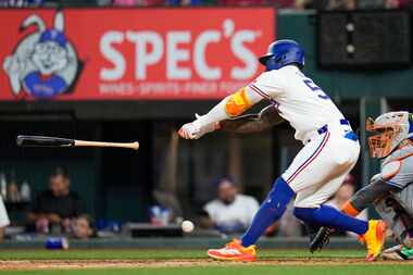 Texas Rangers Adolis Garcia lost his bat while striking out against the New York Mets during...