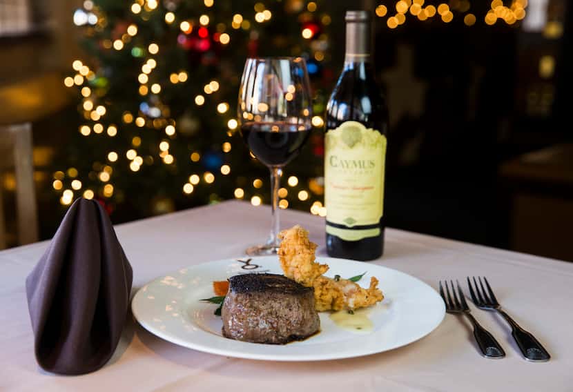 Petite filet and chicken fried lobster paired with a glass of Caymus Vineyards Cabernet...