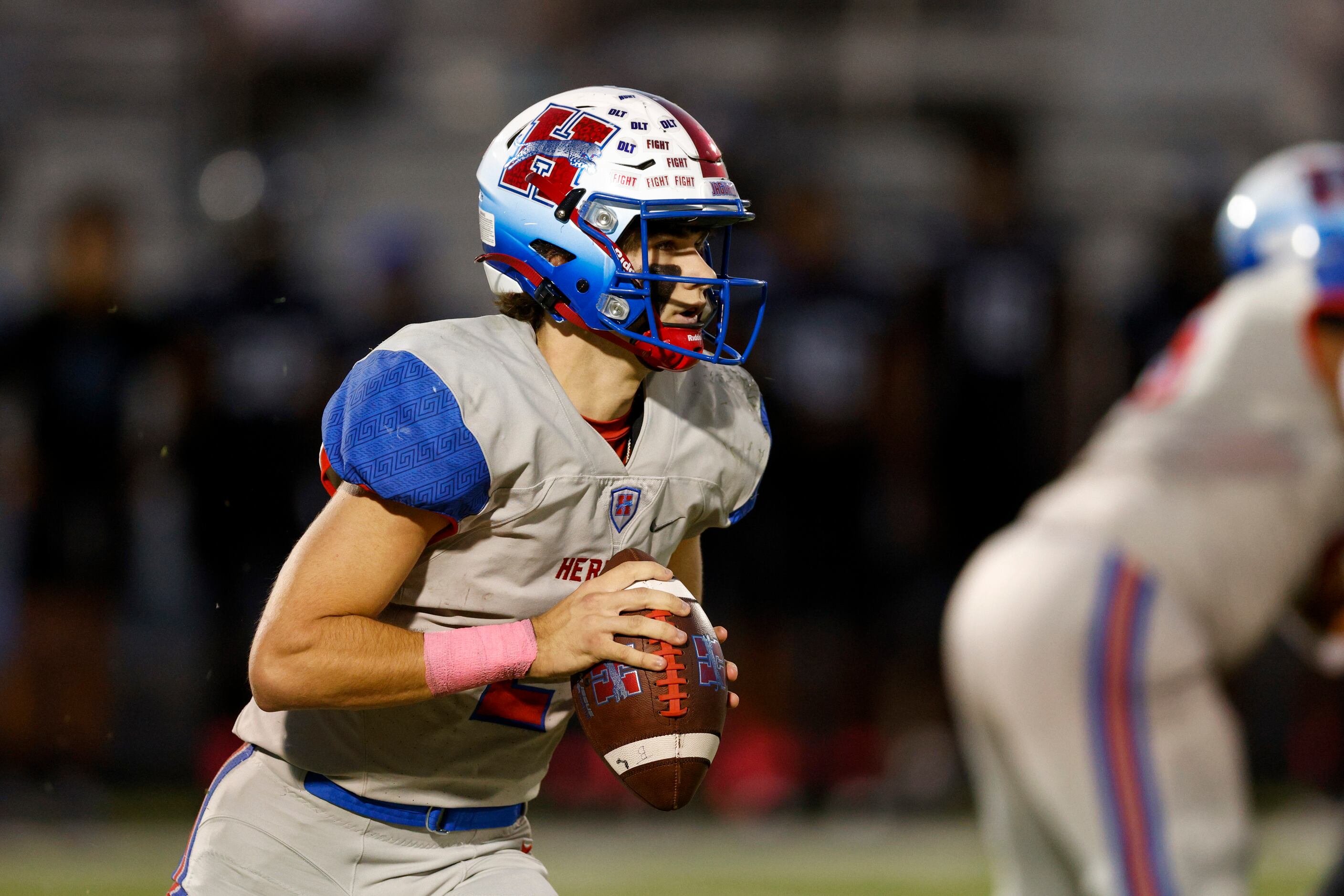 Midlothian Heritage quarterback Kaden Brown (2) runs with the ball during the first half of...