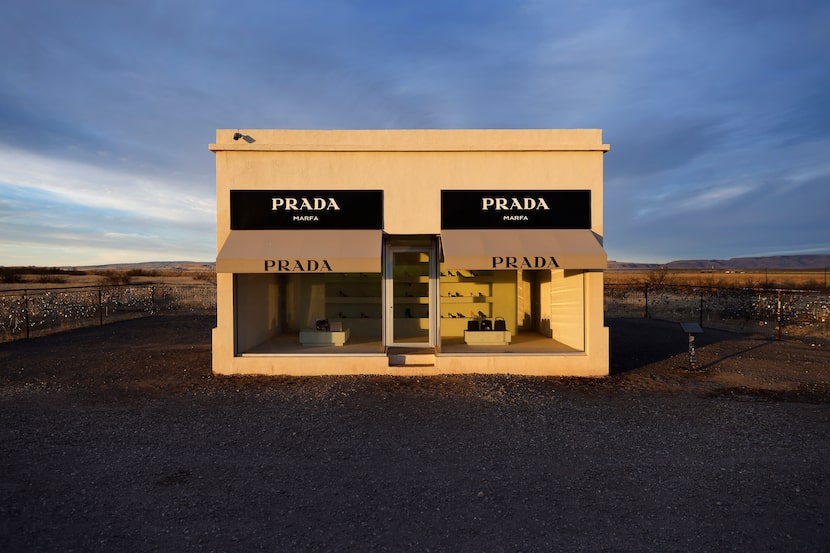 The sun rises on the permanent art installation of Prada Marfa along U.S. Route 90...