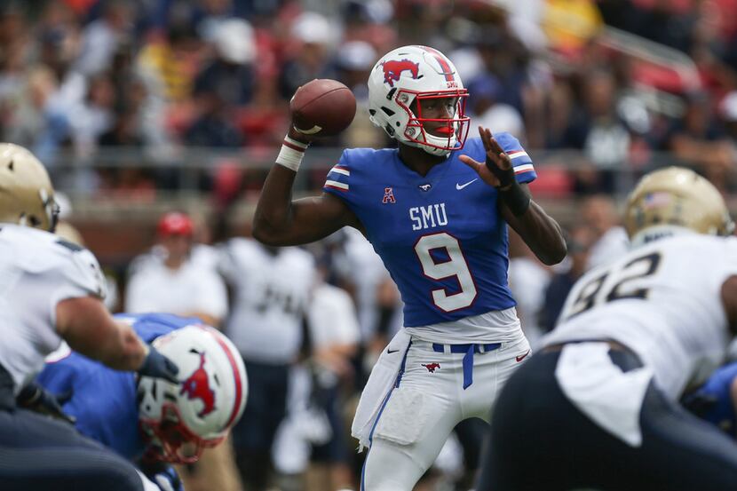 SMU quarterback William Brown (9) fires off a pass against Navy during an NCAA college...