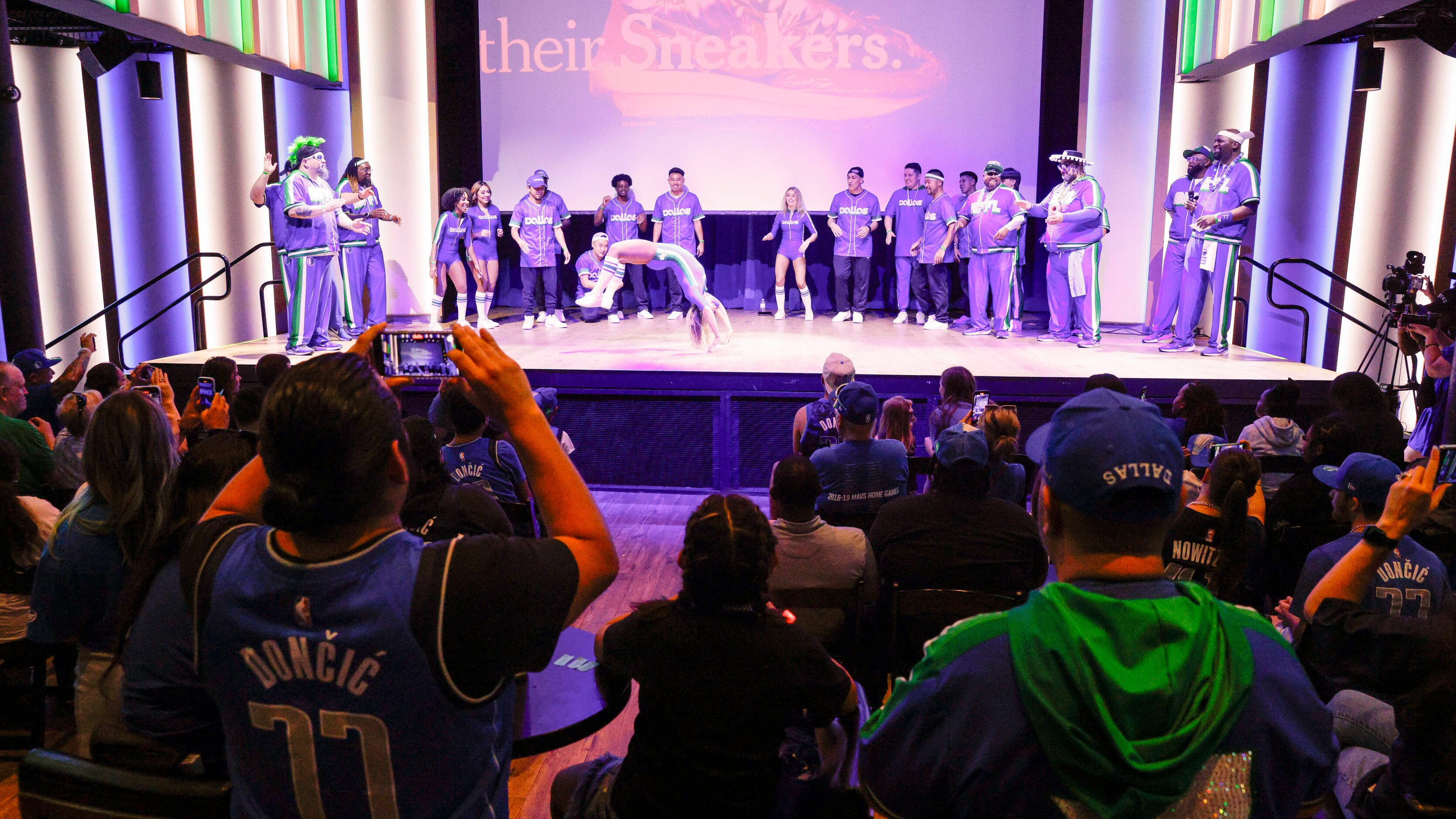 Dallas Mavericks fans watch a performance by the D-Town Crew, Maniaacs and Mavs Breakers...