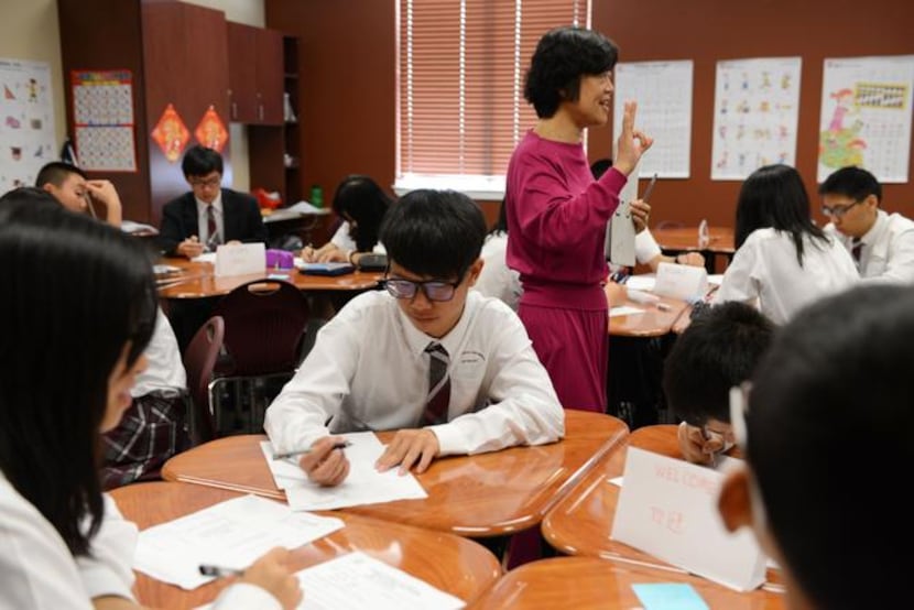 
Shen leads her class of Chinese exchange students in a lesson at IL Texas charter school in...