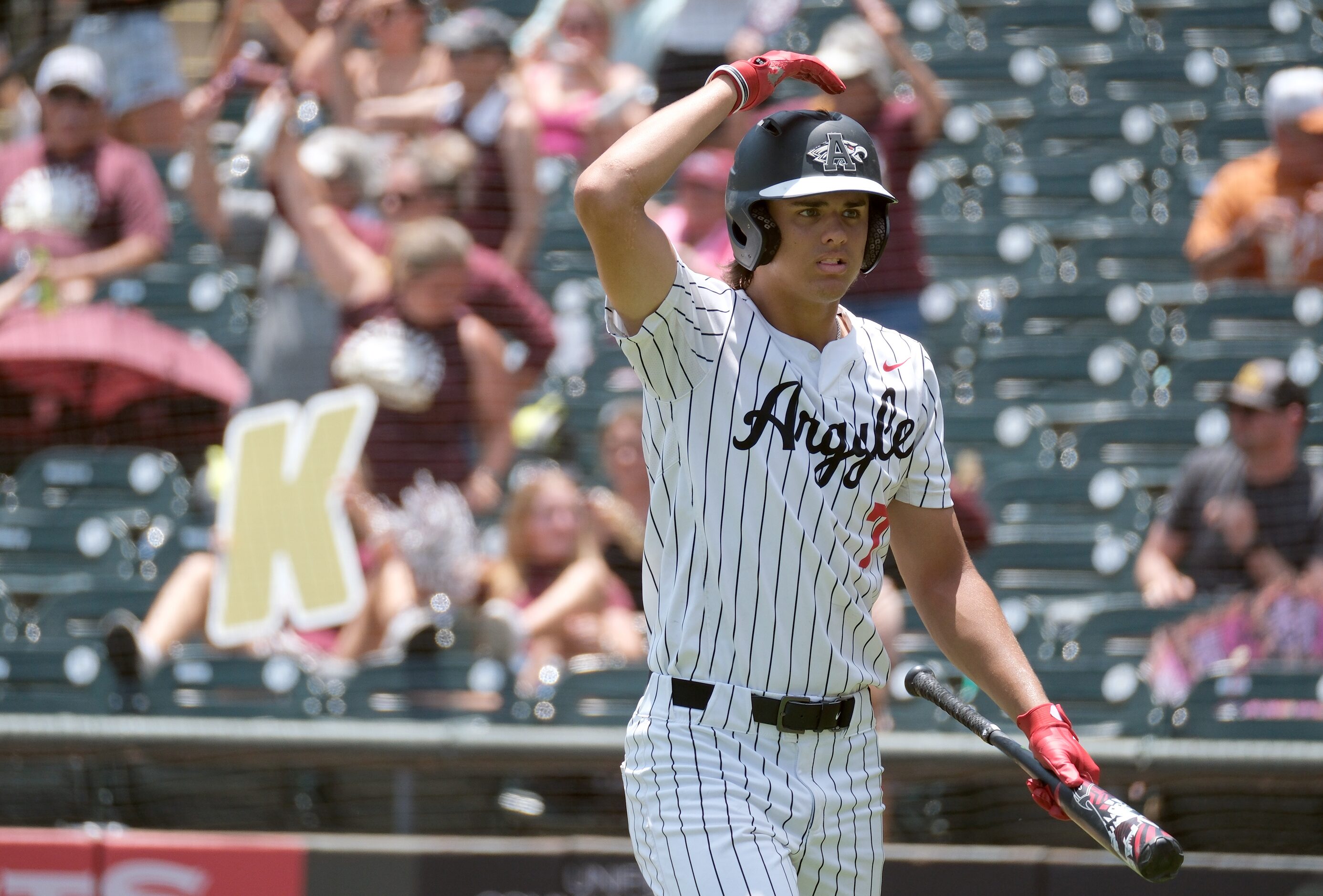 Argyle Park Prater, (7), walks back to the dugout after being struck out by Magnolia West...