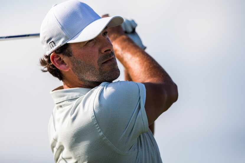 Former Dallas Cowboys quarterback Tony Romo tees off in a Mahan Foundation Match Play...