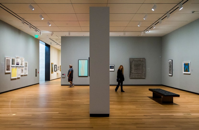 Visitors walk through the second floor temporary exhibitions at the Amon Carter Museum of...