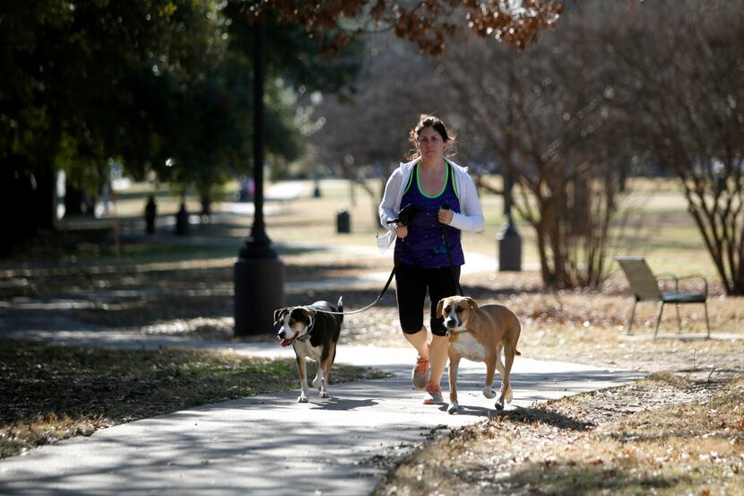 Audrey Keech takes advantage of the unseasonably warm weather to jog around Exall Park with...