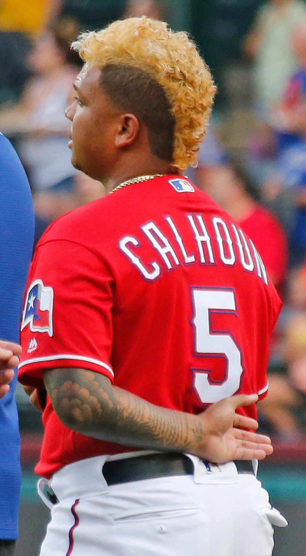 Texas Rangers designated hitter Willie Calhoun (5) stands during the national anthem before...