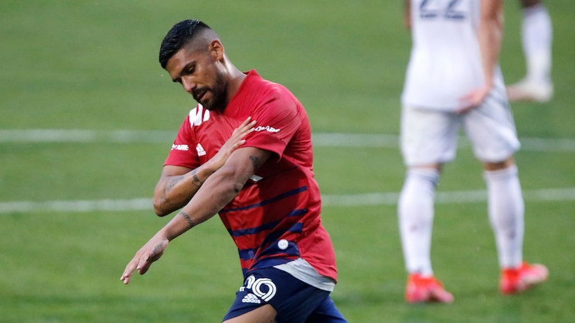 FC Dallas forward Franco Jara (29) brushes himself off after scoring a goal on a penalty...