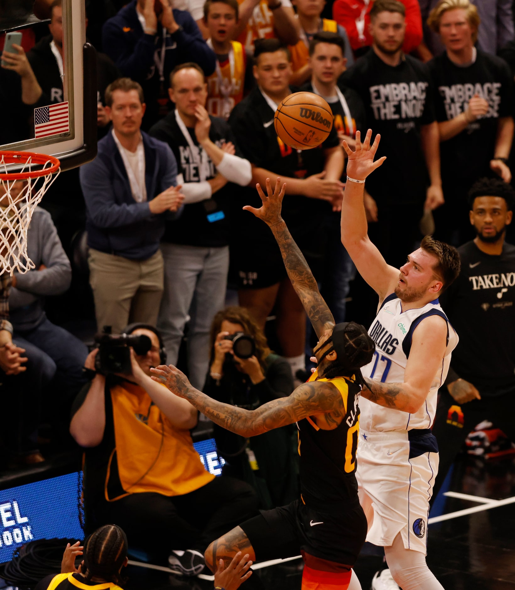 Dallas Mavericks guard Luka Doncic (77) attempts a shot in front of Utah Jazz guard Jordan...