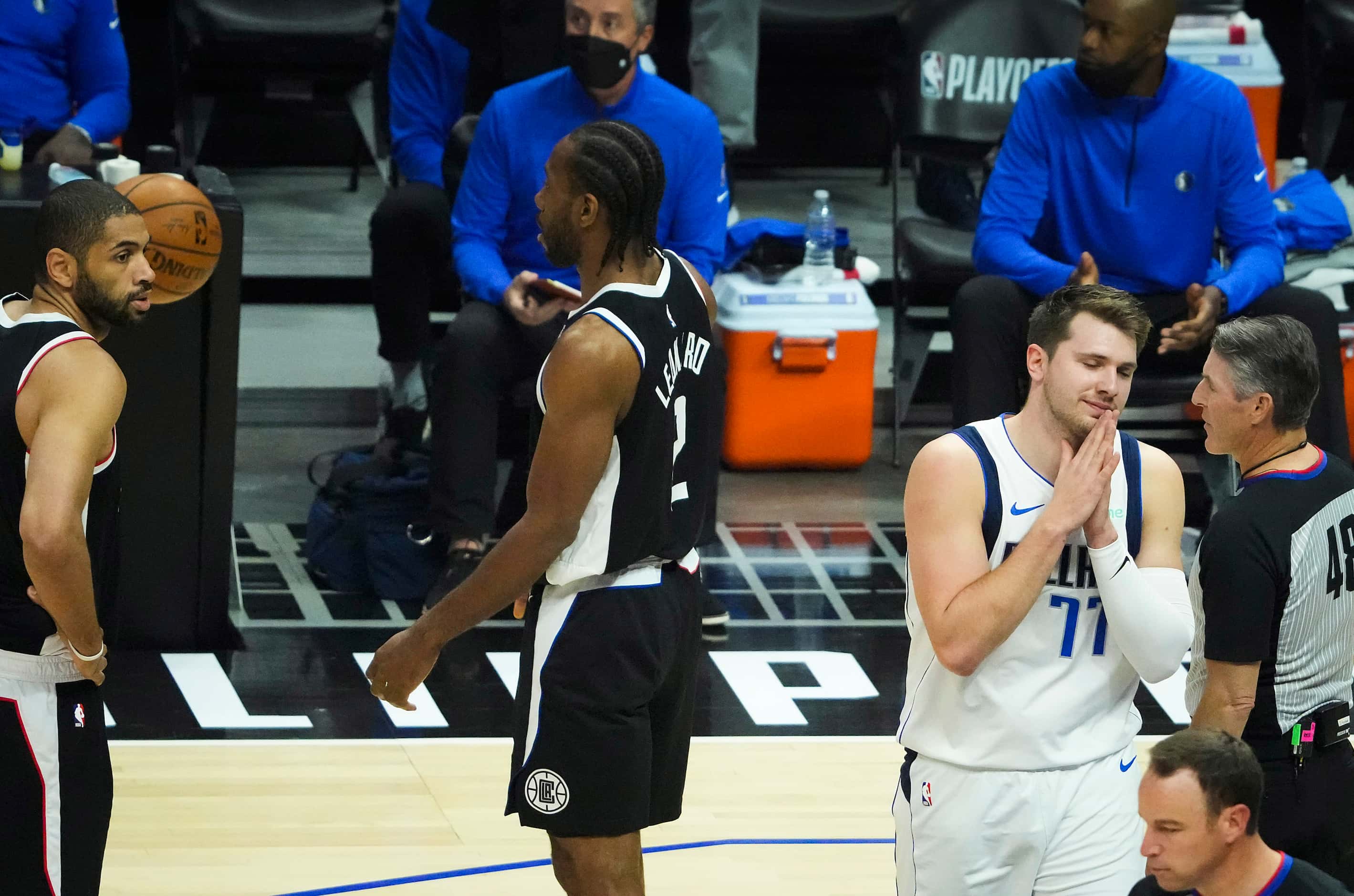 Dallas Mavericks guard Luka Doncic (77) reacts after having a call go against him during the...