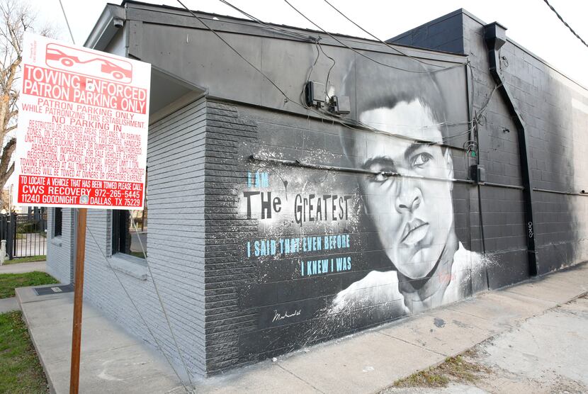 A mural of Muhammad Ali painted by Theo Ponchaveli was on the side of a building off...