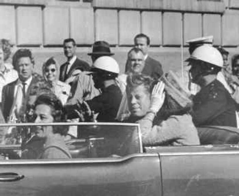 President John F. Kennedy and first lady Jacqueline Kennedy in the motorcade before the...