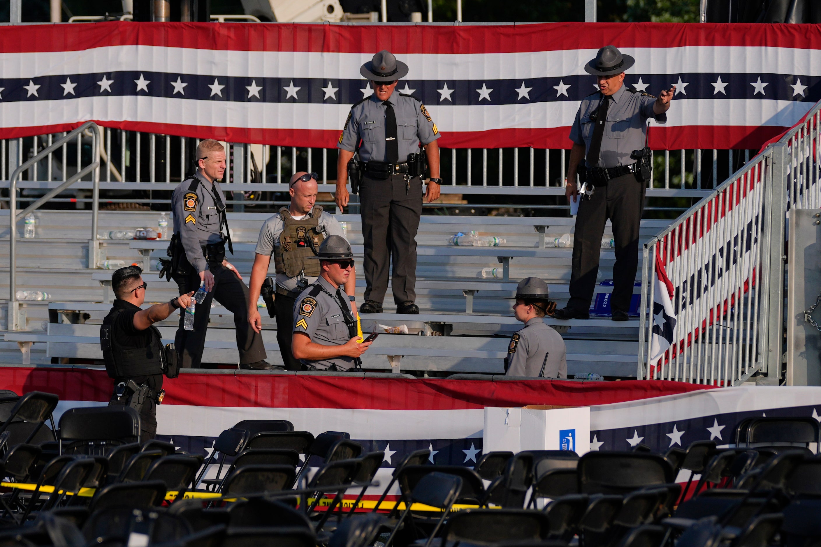 Law enforcement officers gather at the campaign rally site for Republican presidential...