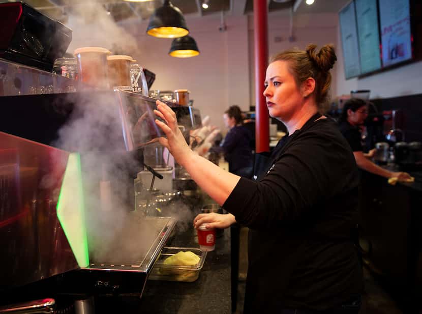 Team supervisor Meredith Owens prepares a latte at Stella Nova, a new coffee shop at Snider...