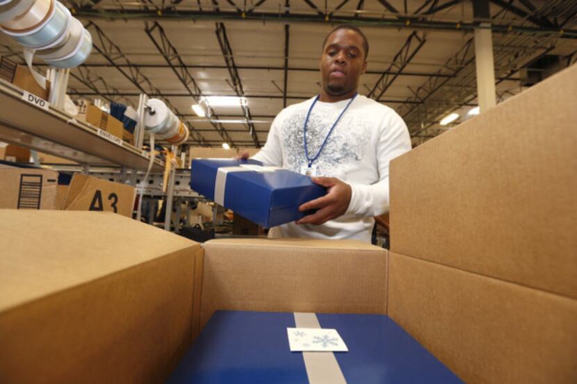 The boom in online ordering began on Cyber Monday  and kept going. Amazon.com employee Hugh...