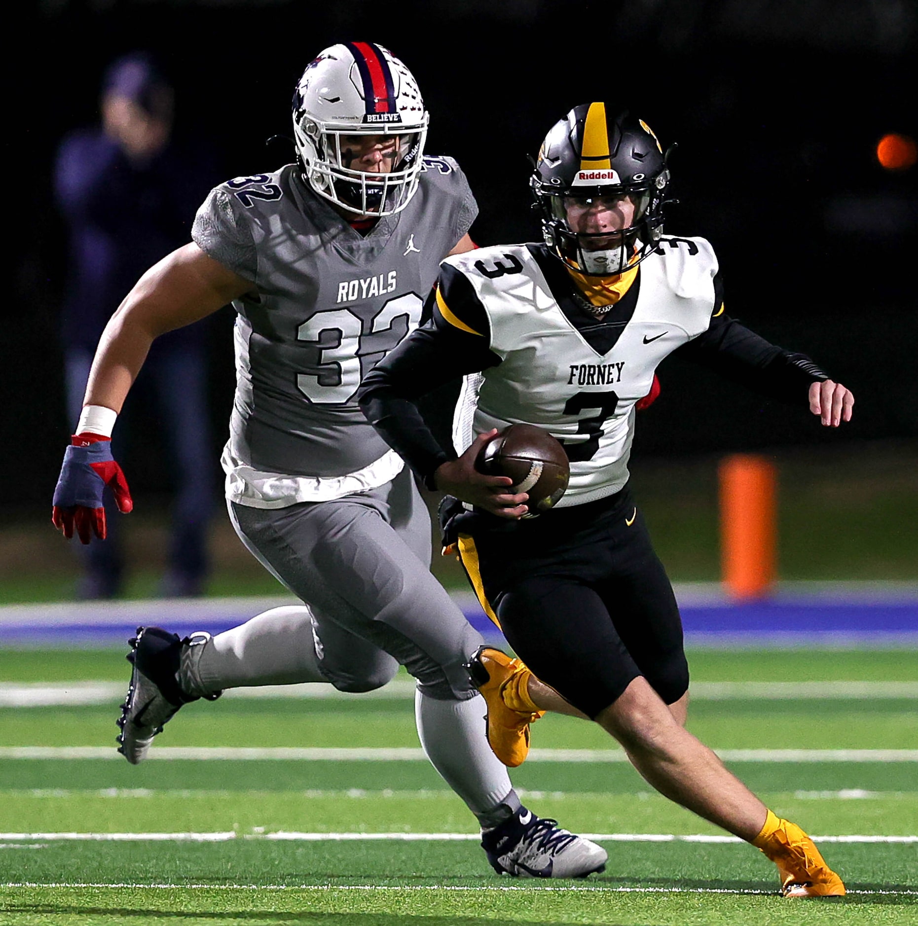 Forney quarterback Kyle Crawford (3) scrambles past Richland defensive lineman Colton Penn...