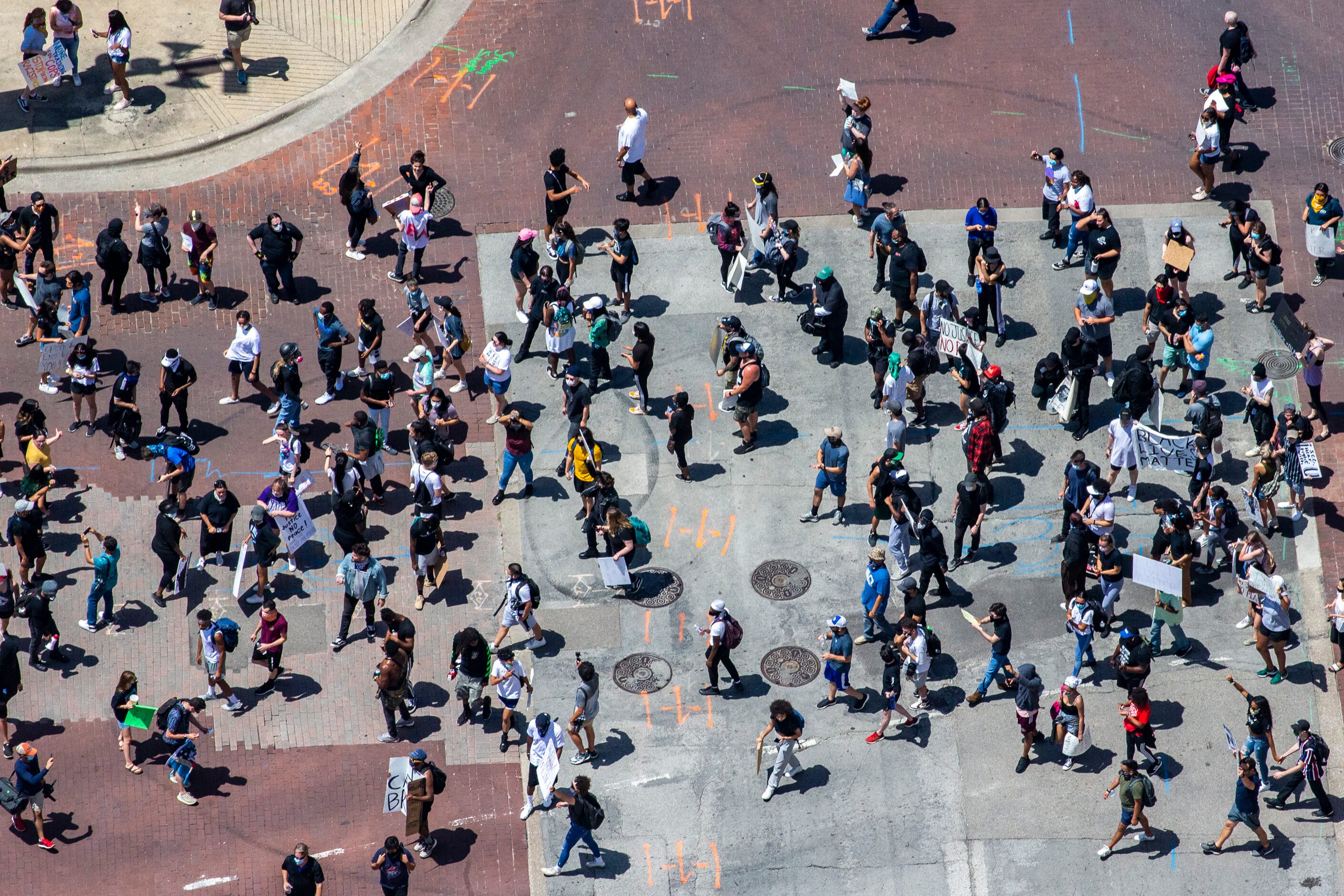 Protesters march throughout the downtown streets of Dallas during a demonstration denouncing...