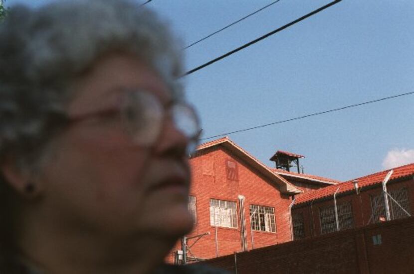 In this photo from August 1999, Lois Robison stands in front of the 'Walls Unit'  while...