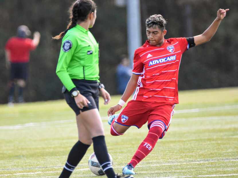 Edwin Villarreal shoots past a referee while playing for FC Dallas Academy.