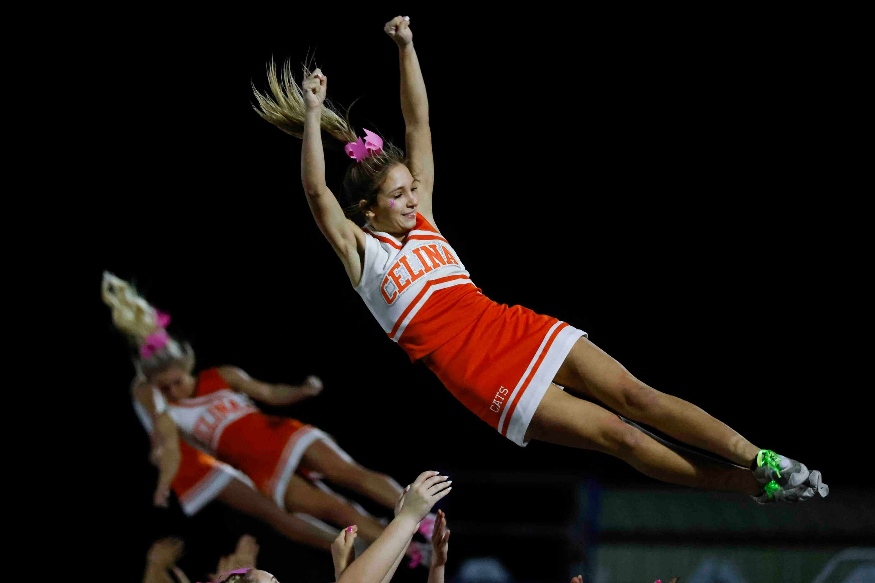 Celina High School cheerleaders perform during the second half of a football game against...