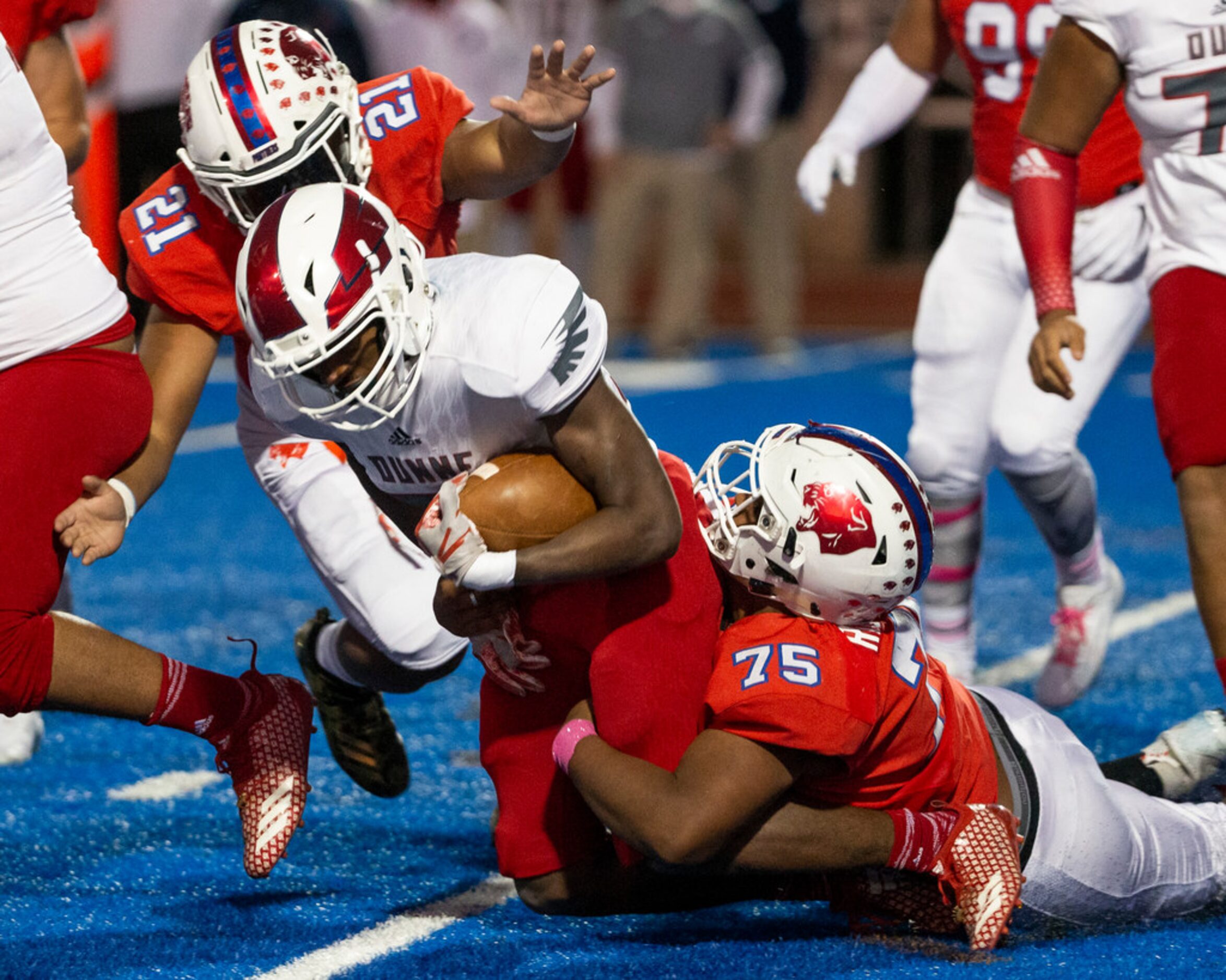 Bishop Dunne running back Grant Barksdale (32) gets sacked by Parish Episcopal defensive...