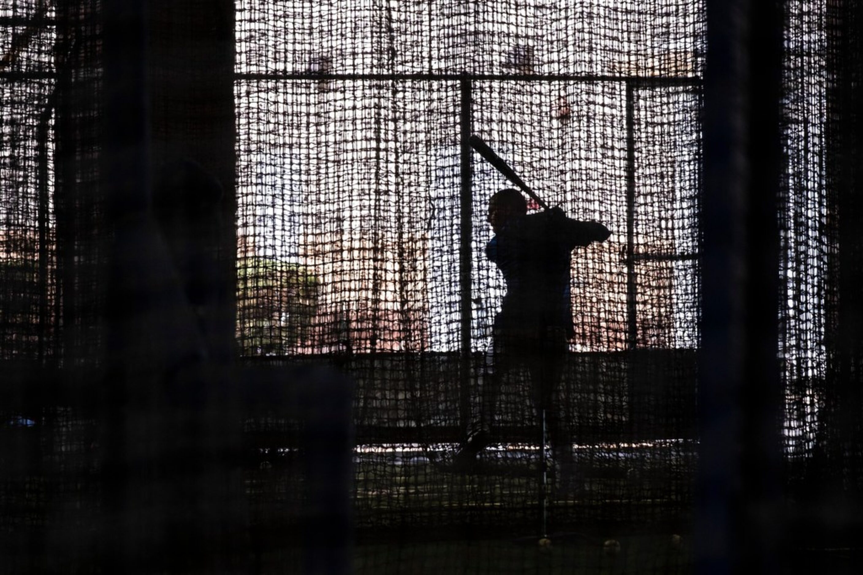 Texas Rangers outfielder Carlos Tocci hits in the batting cages during a spring training...