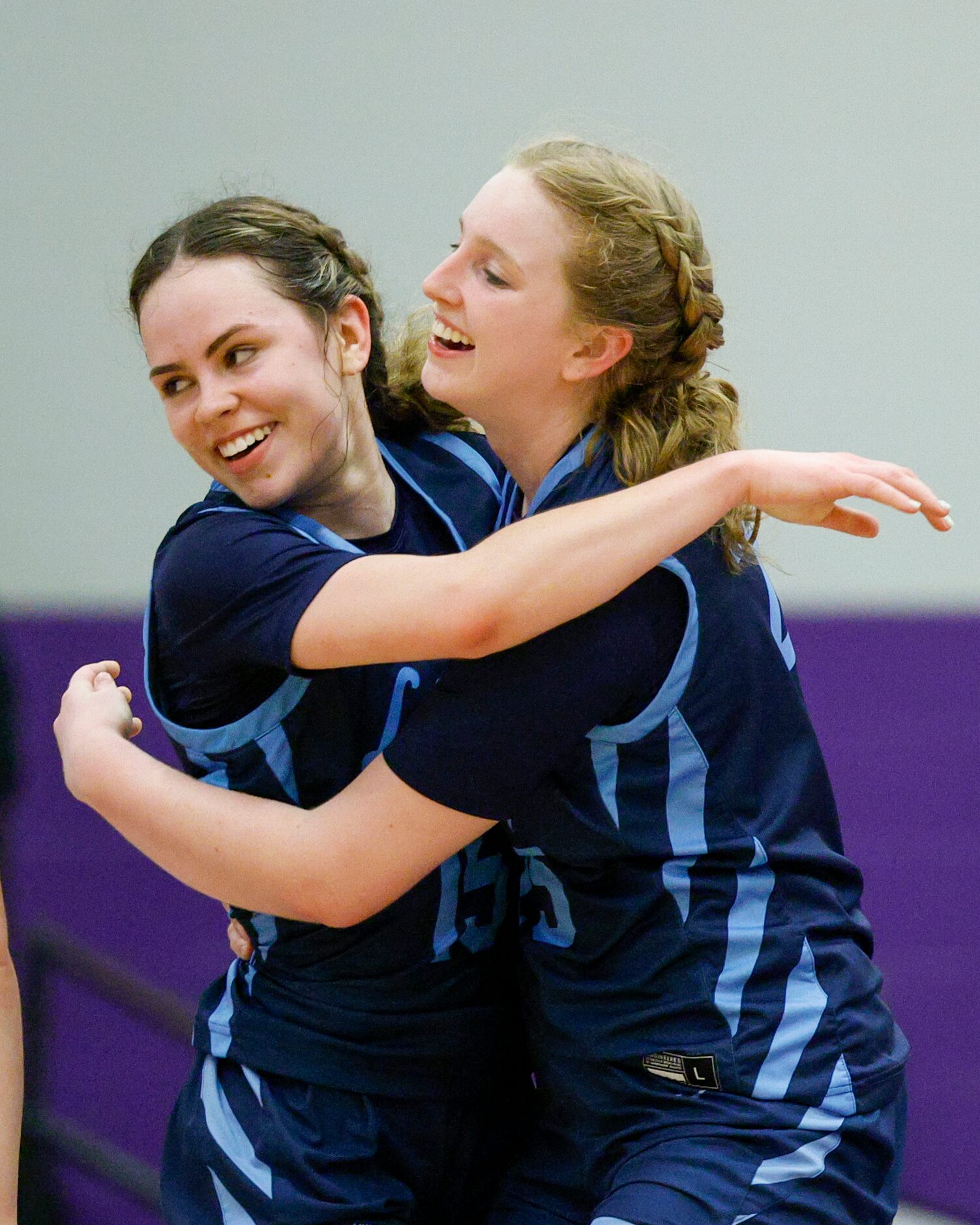 Argyle Liberty Christian guard Emma Martin (left) celebrates her buzzer-beating three-point...