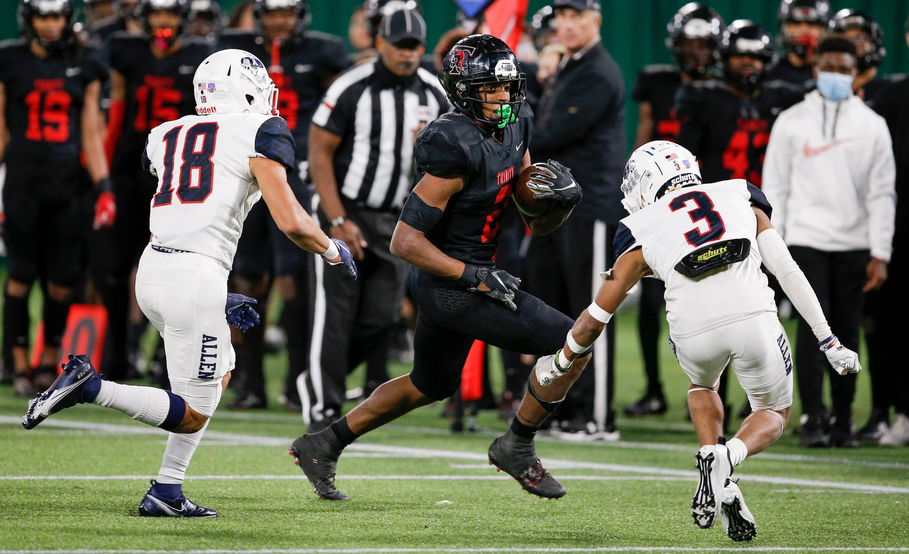 Euless Trinity junior running back Ollie Gordon (2) looks for room against Allen senior...