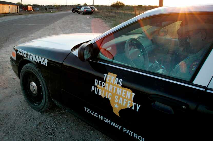 FILE - In this April 6, 2008, file photo, a Texas State Trooper is shown sitting in his...