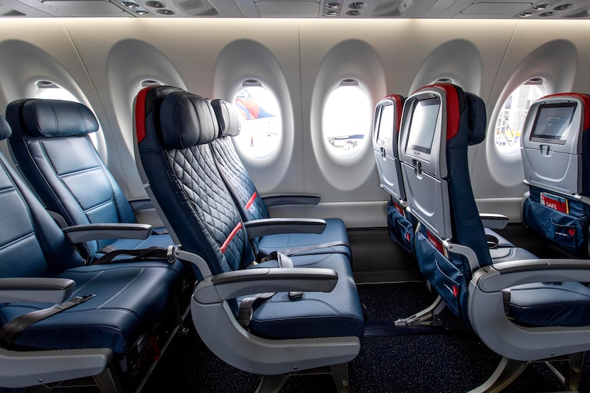 Economy class (left) and Comfort+ (center and right) rows of seating on Delta's new Airbus...