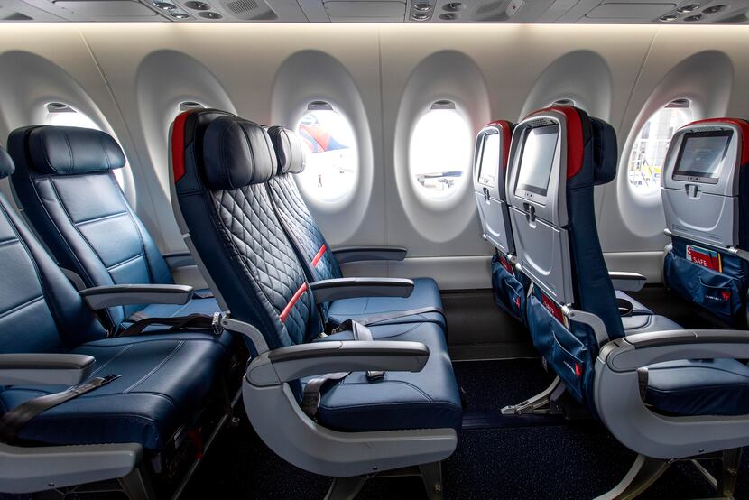 Economy class (left) and Comfort+ (center and right) rows of seating on Delta's new Airbus...