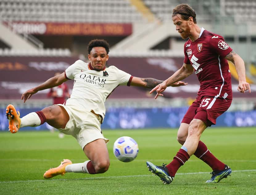 Roma's Bryan Reynolds, left and Torino's Cristian Ansaldi, right,  fight for the ball during...