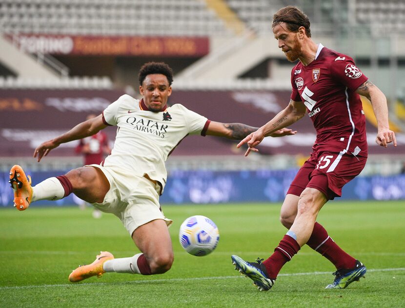 Roma's Bryan Reynolds, left and Torino's Cristian Ansaldi, right,  fight for the ball during...