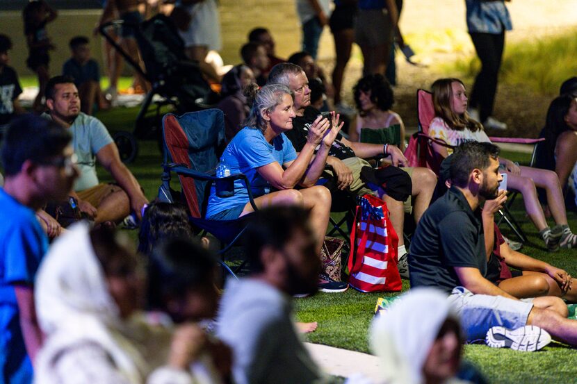 Cheryl and Charles Fatka of Arlington watch the Illuvia show at Epic Central in Grand...