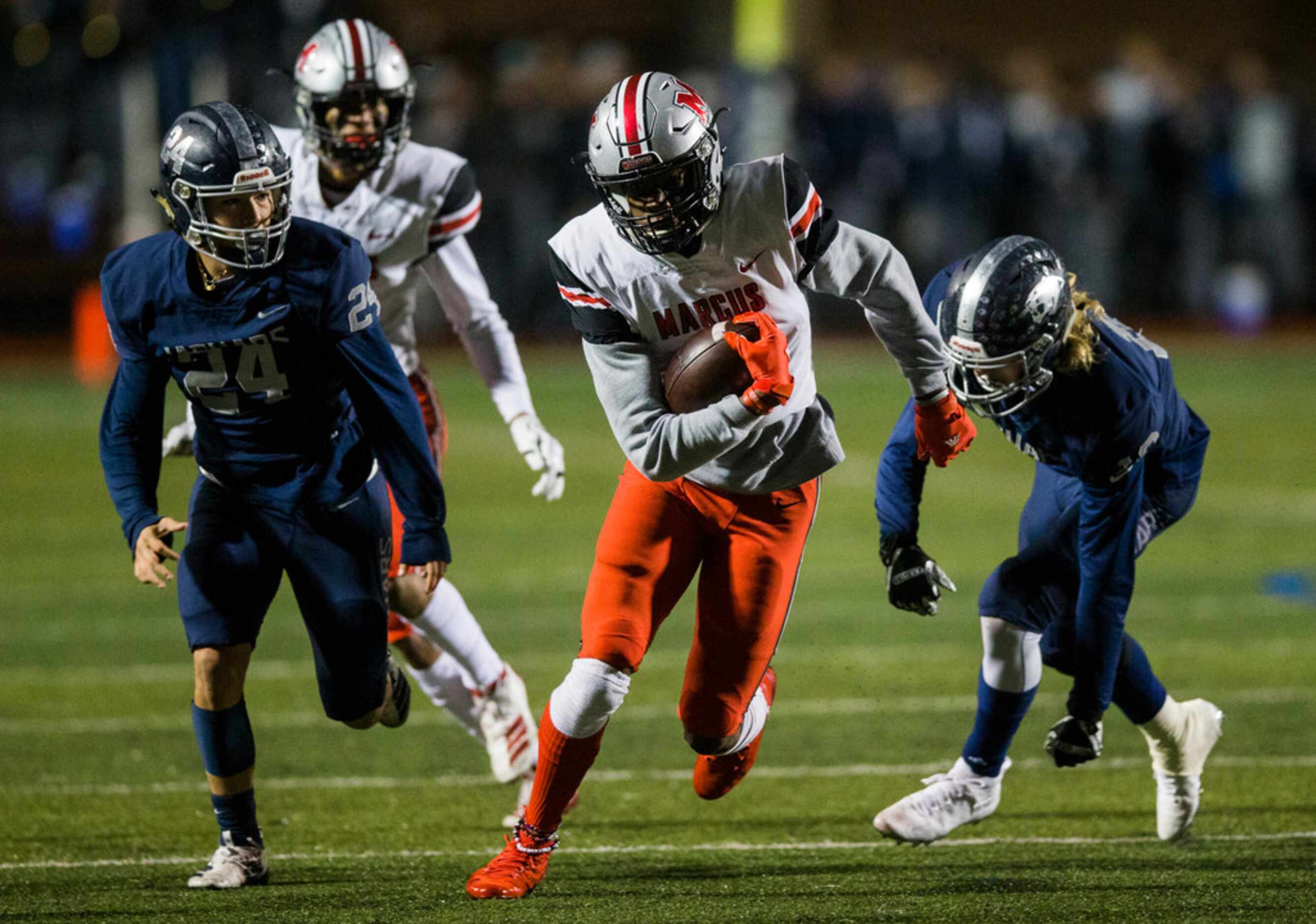 Flower Mound Marcus wide receiver J. Michael Sturdivant (7) runs the ball during the first...