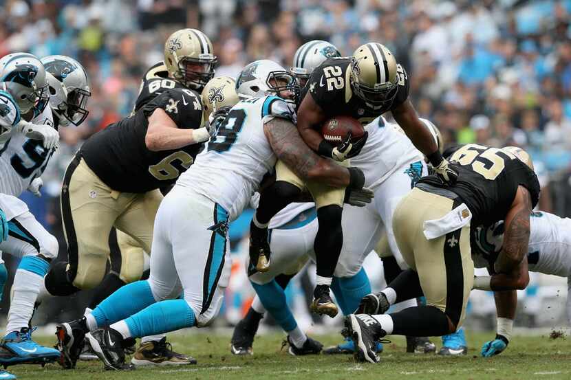 CHARLOTTE, NC - SEPTEMBER 27:  Mark Ingram #22 of the New Orleans Saints runs the ball...