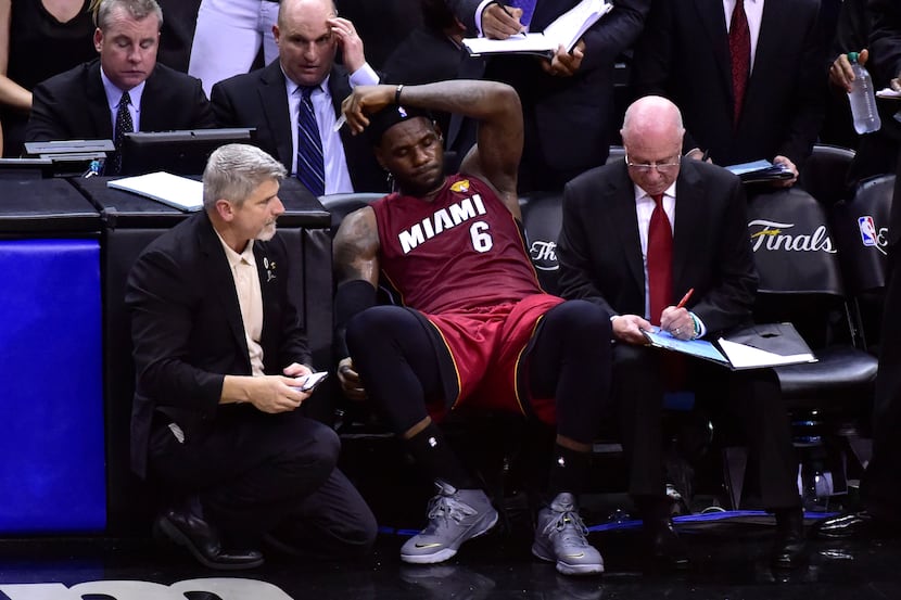 Jun 5, 2014; San Antonio, TX, USA; Miami Heat forward LeBron James (6) reacts on the bench...