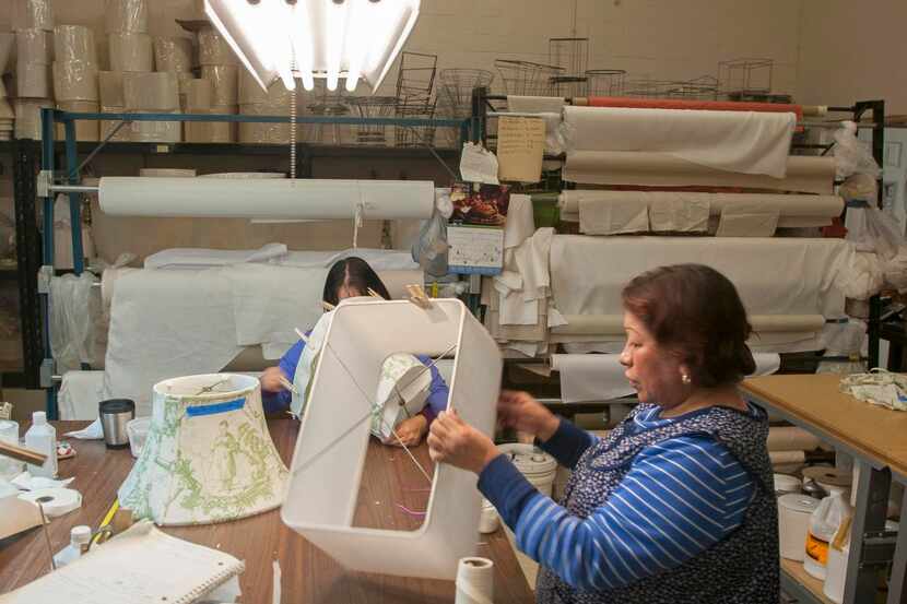 
Maria Zavala makes lampshades in the Lamp Shoppe’s workroom. The store employs craftsmen,...