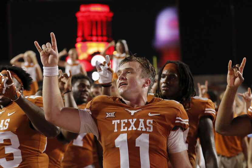 AUSTIN, TX - OCTOBER 07:  Sam Ehlinger #11 of the Texas Longhorns sings the Eyes of Texas...