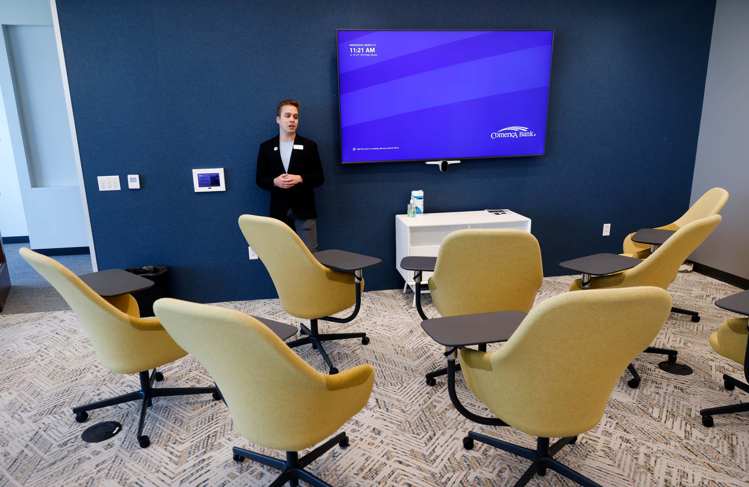 Comerica’s Austen Merconti shows Microsoft Team Room with video conferencing during a tour...
