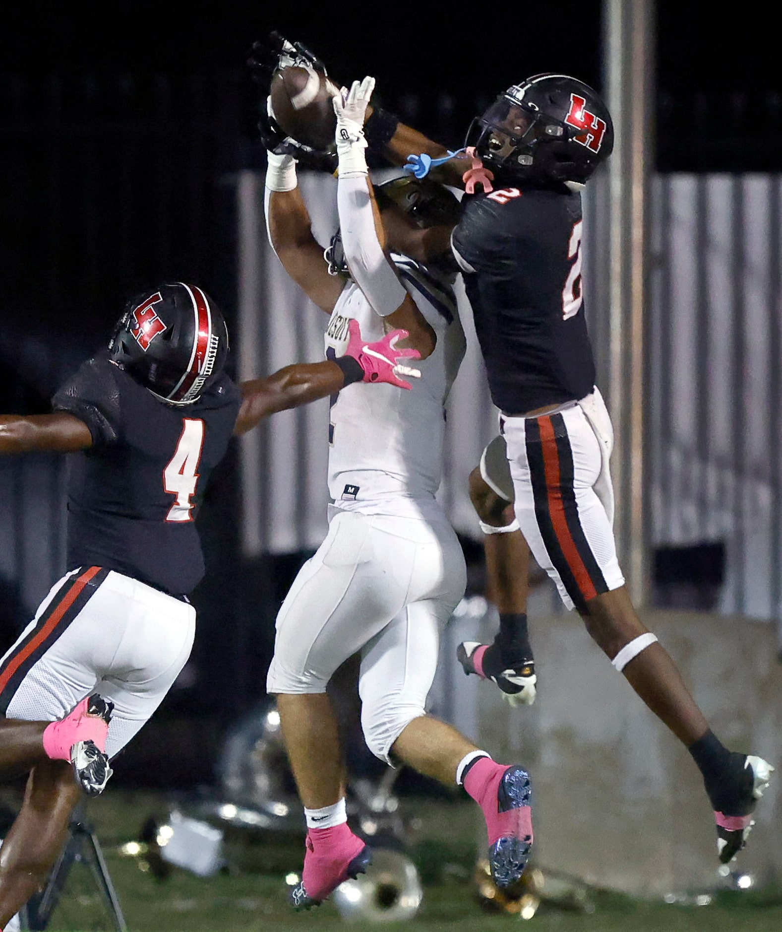 Lake Highlands High defensive back Ayden Webb (2) goes over the top of Jesuit Dallas...