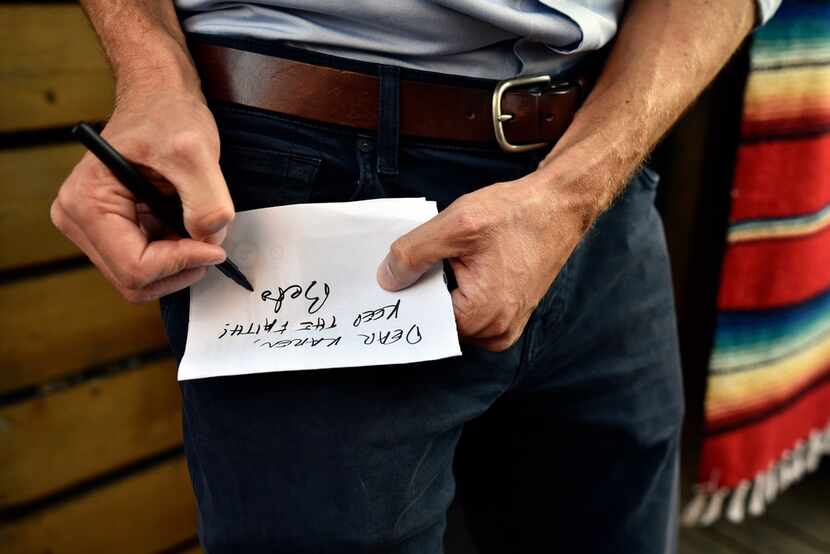 U.S. Senate candidate Beto O'Rourke signs a message to a supporter that reads, "Dear Karen,...