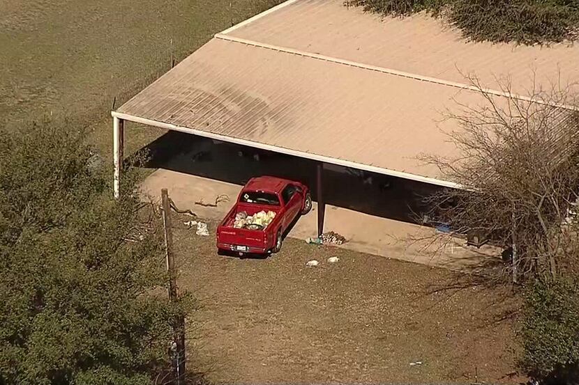 An aerial photo shows the home where officials say Wise County Sheriff's deputies found four...