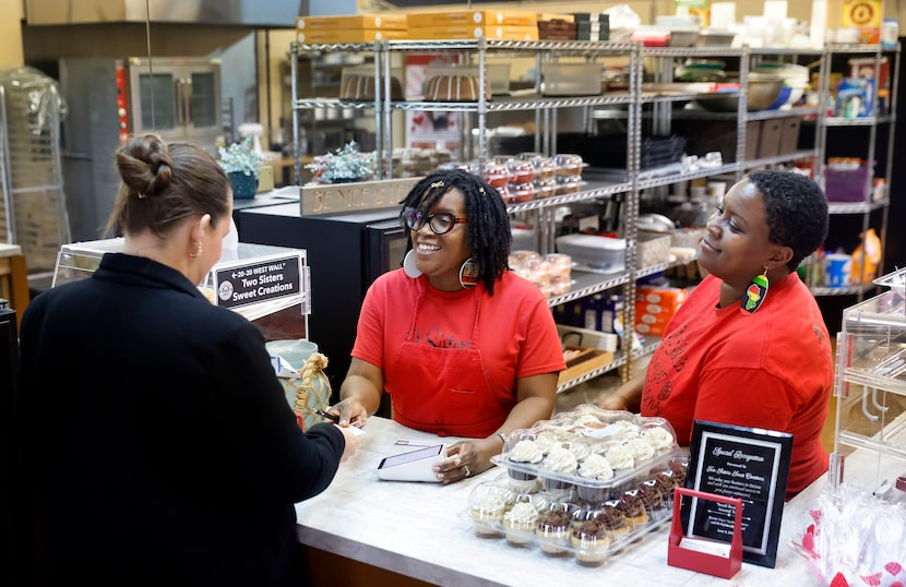 Sisters Deidra Keener (center) and Yolanda Bledsoe (right) visit with Rachel Redmon who...