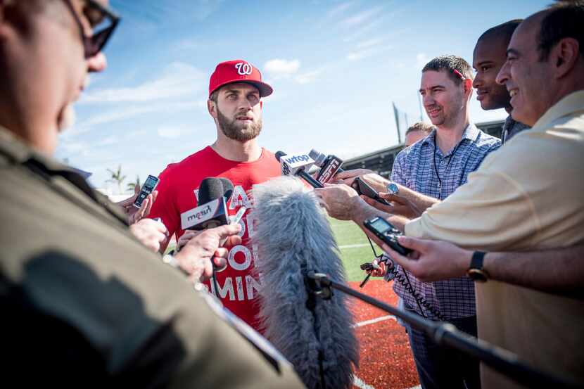 Washington Nationals right fielder Bryce Harper answers questions from the media at spring...