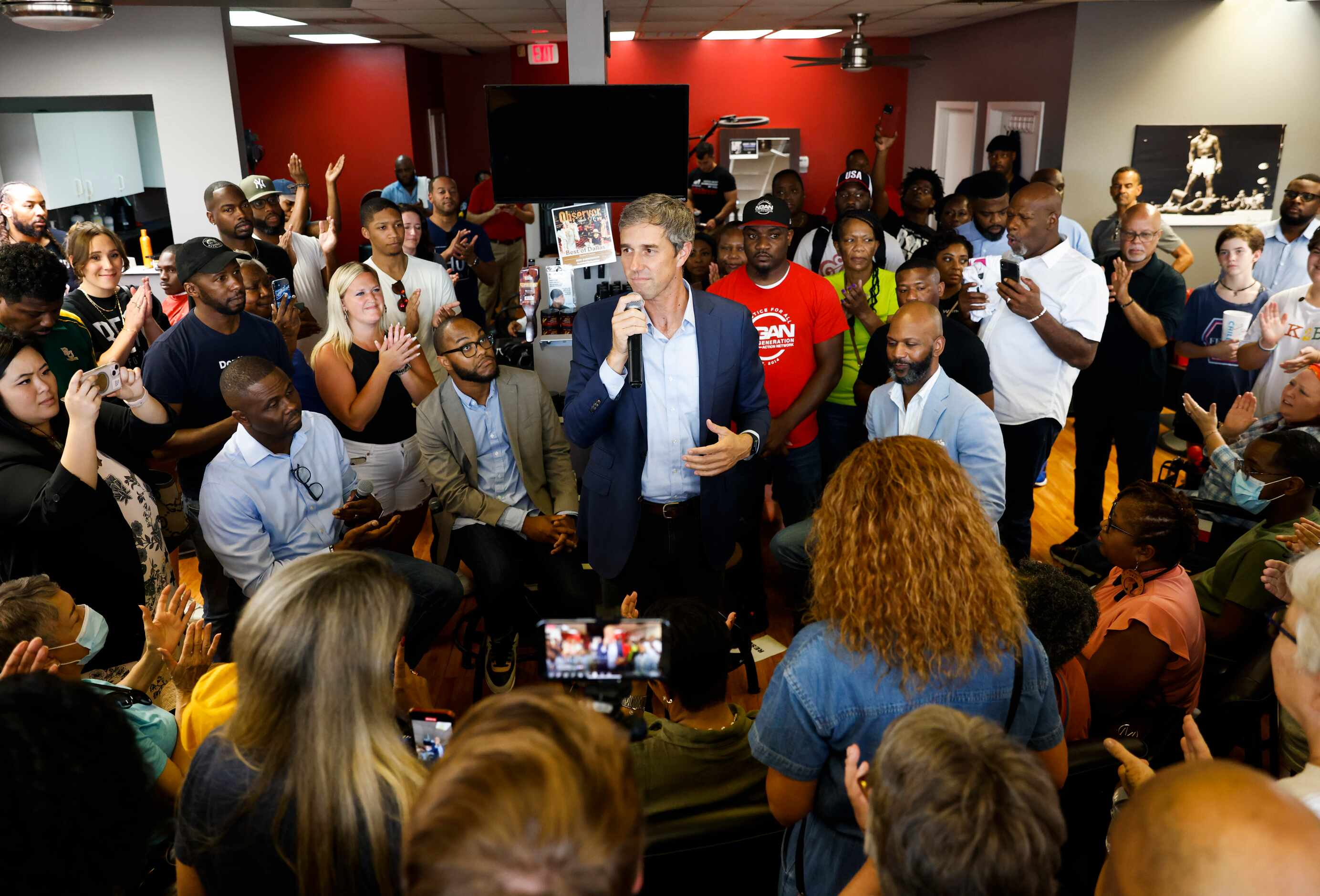 Supporters surrounds and cheers for Texas Governor candidate Beto O'Rourke as he speaks at...