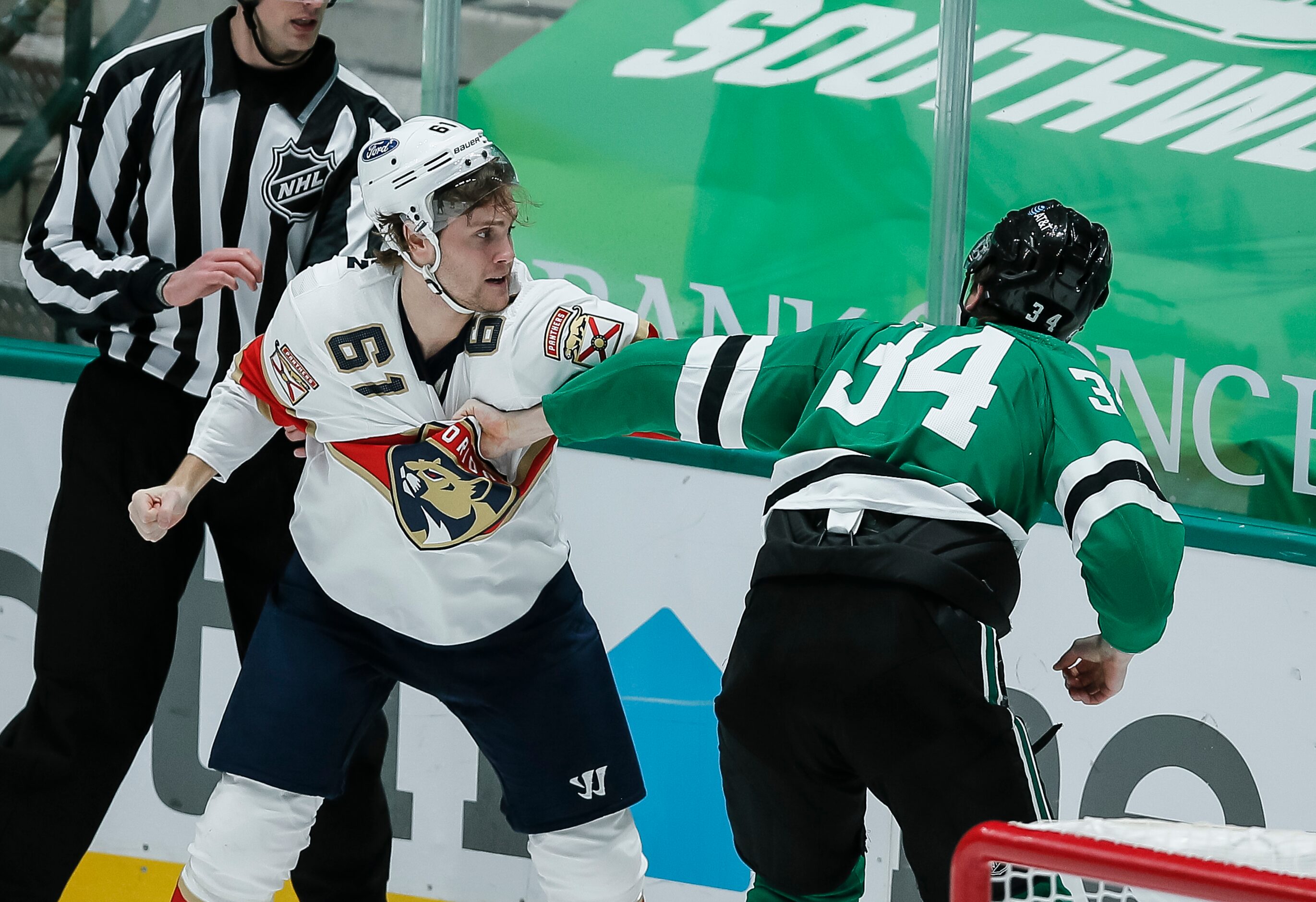 Florida Panthers defenseman Riley Stillman (61) and Dallas Stars forward Denis Gurianov (34)...