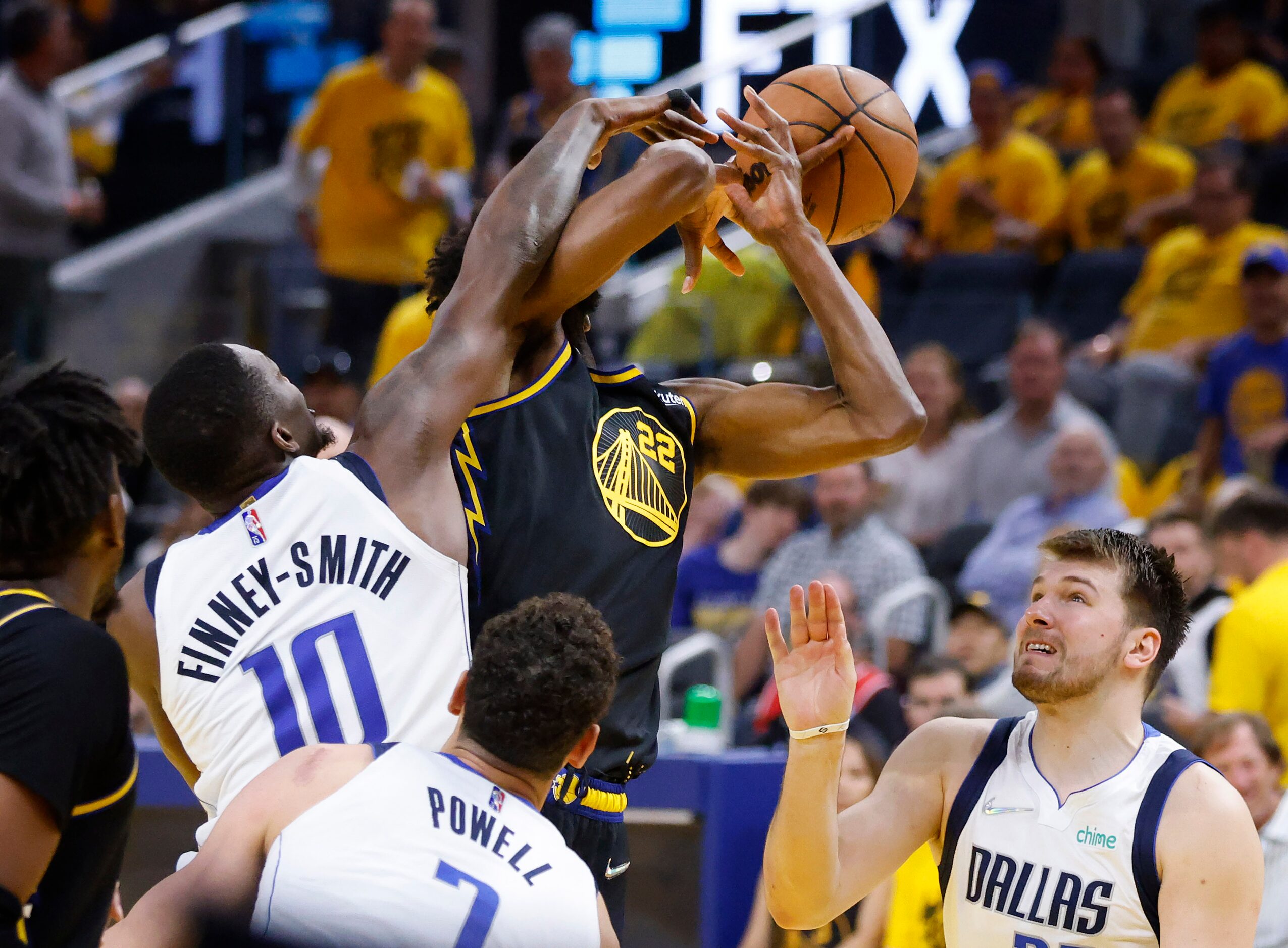 Dallas Mavericks forward Dorian Finney-Smith (10) knocks the ball out of Golden State...