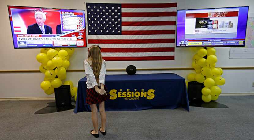  Elizabeth Ward, 11, watches CNN at the U.S. Rep. Pete Sessions' campaign headquarters in...